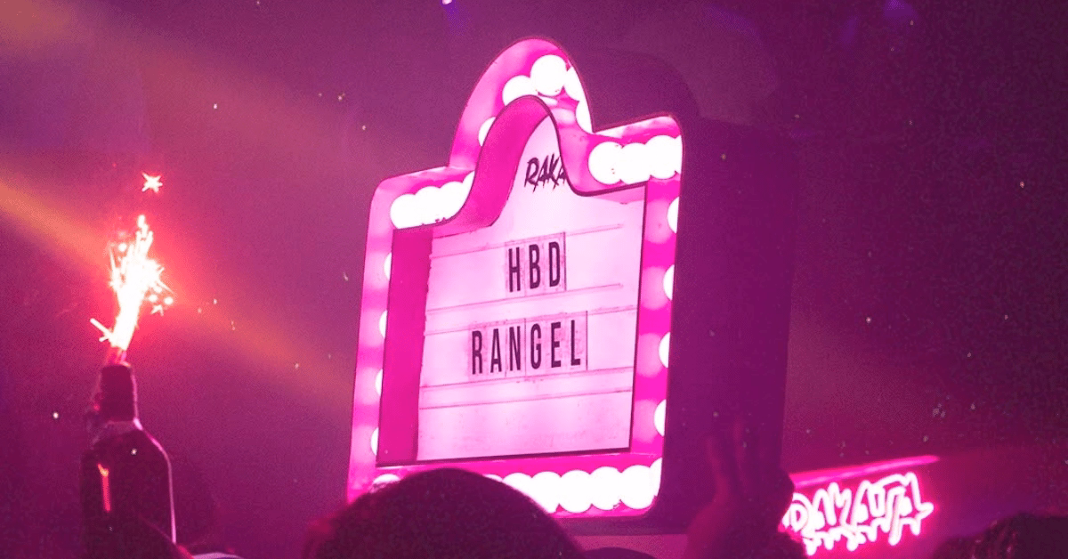 A pink-lit marquee says HBD RANGEL at a nightclub party, with a bottle and sparkler held up in the festive crowd.