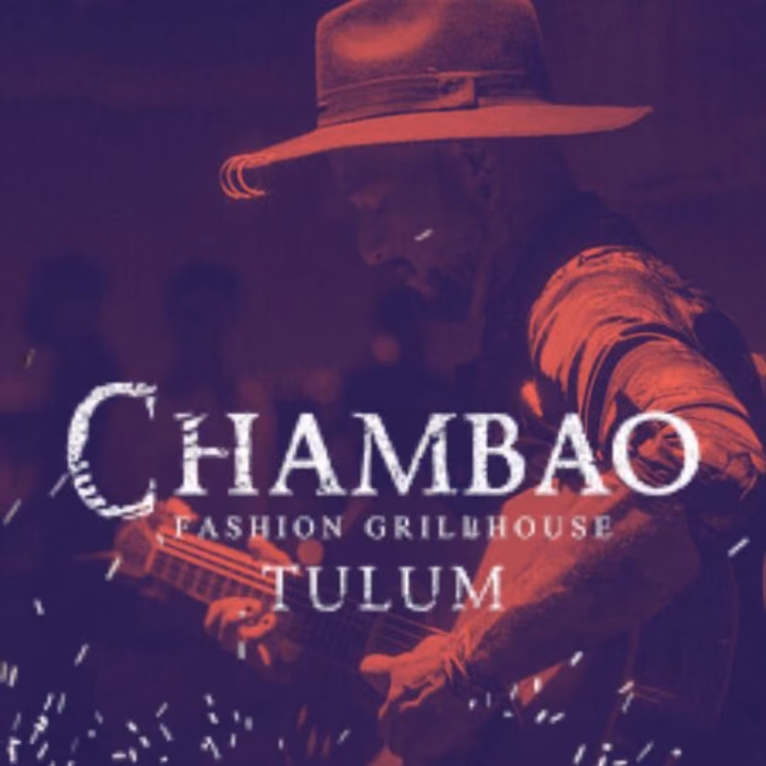A guitarist in a hat performs in low light. Text overlay: CHAMBAO FASHION GRILLHOUSE TULUM.
