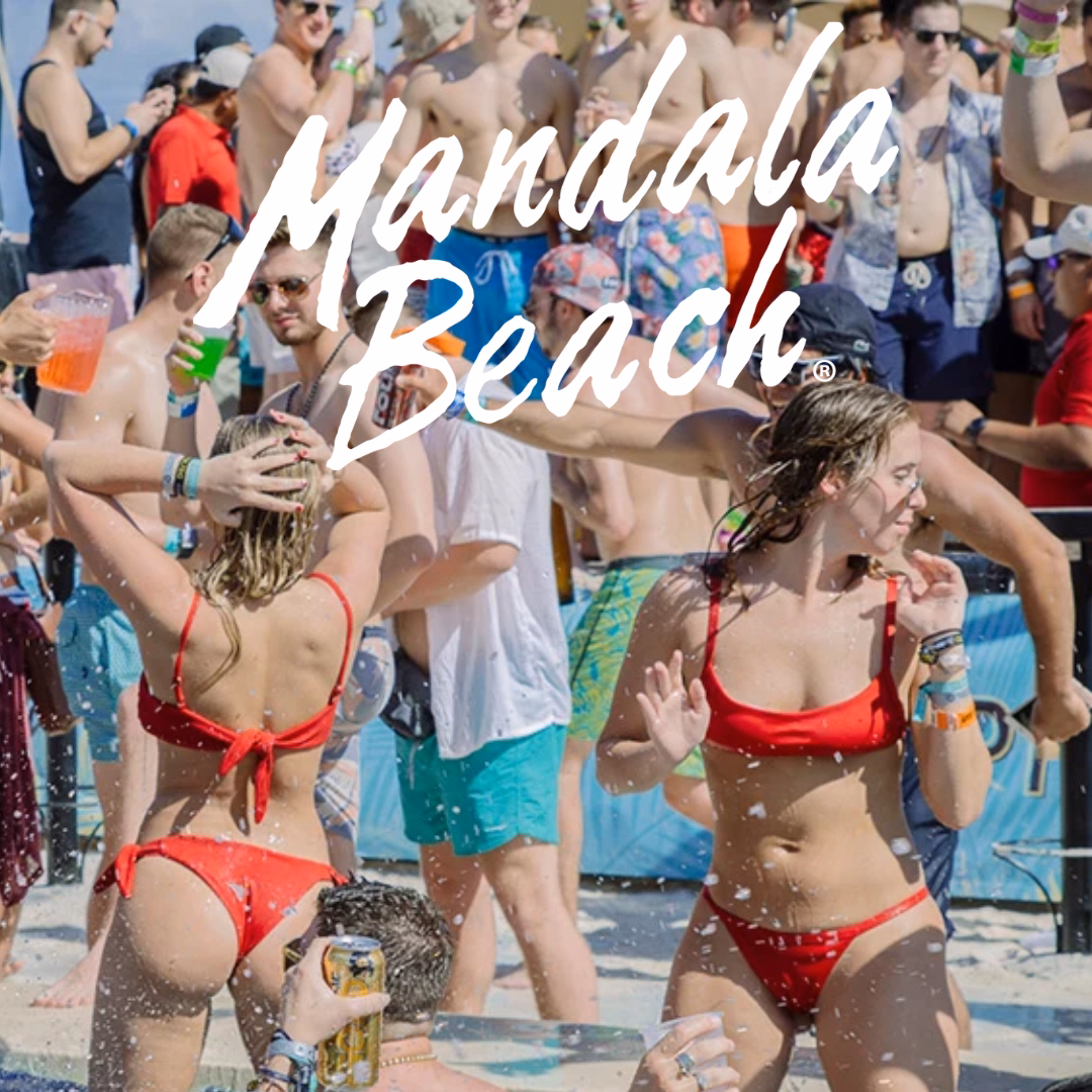 Young adults party on a busy beach, drinks in hand; two women in red bikinis up front. “Mandala Beach” appears in white script.